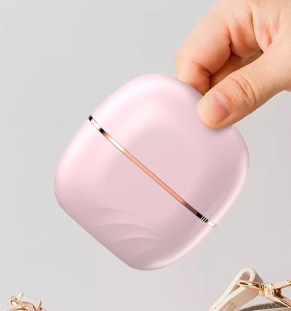 Portable wireless hair straightening comb for safe, easy styling.